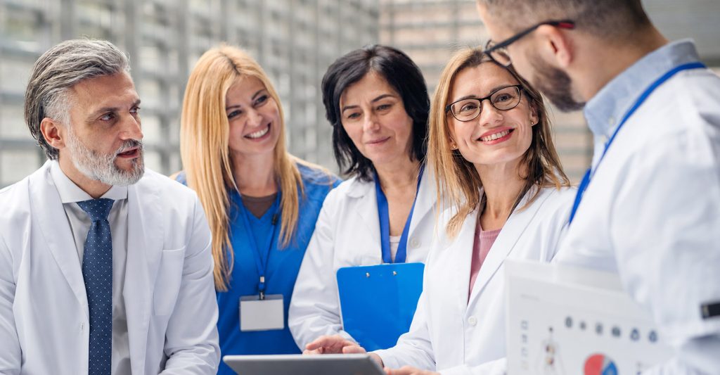 Medical-Team-Reviewing-a-Clipboard
